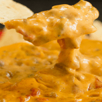 A Super Cheesy Crock Pot Spicy Beef Queso Dip